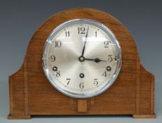An oak cased mantel clock by Garrard, Westminster chimes, 23cm tall