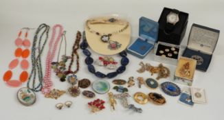 A collection of costume jewellery including 9ct gold crucifix and chain, silver necklace,