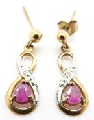 A pair of 9ct gold earrings set with a pink sapphire and a diamond to each, 1g
