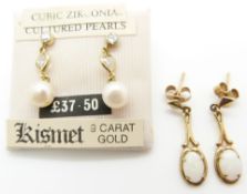A pair of 9ct gold earrings set with an opal to each and a pair of 9ct gold earrings set with