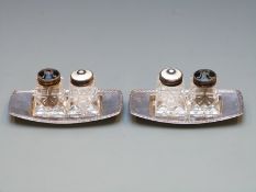 Pair of David Andersen enamel salts and peppers on bases, the guilloché enamel tops marked