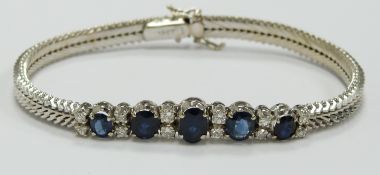 An 18ct white gold bracelet set with five graduated oval sapphires measuring approximately 0.65, 0.