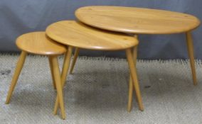 Nest of three Ercol pebble tables in light elm, width 65cm