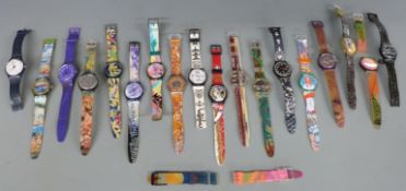 Eighteen Swatch wristwatches with various multi-coloured designs together with spare straps.
