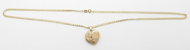 A 9ct gold chain/necklace and a yellow metal locket with floral decoration, 4.7g