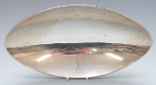 White metal oval bowl raised on four tapering feet, marked Sterling silver, length 30.5cm, weight