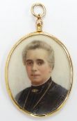 Edwardian 15ct gold double sided locket set with painted ivory portrait miniatures, one side a lady,