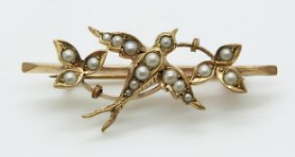 A 9ct gold brooch set with seed pearls in the form of a swallow, 3.6g, 4cm