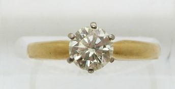 An 18ct gold ring set with a round cut diamond of approximately 0.8ct (size M)