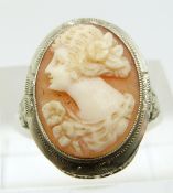 A 14k white gold ring set with a shell cameo and with pierced shoulders, size L