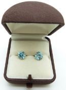 A pair of 9ct gold earrings set with a zircon to each, 2.2g
