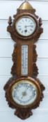 Edwardian oak framed carved aneroid barometer/clock and thermometer compendium, 63cm tall