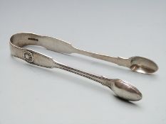 A pair of Victorian hallmarked silver fiddle thread and shell pattern sugar tongs, length 15cm,