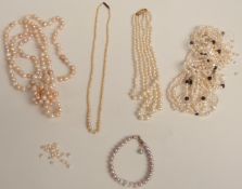 A three strand faux pearl necklace with a 9ct gold clasp, a pearl bracelet and three pearl necklaces