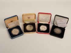 Three cased silver proof commemorative crowns and an 1890 double florin, all with certificates