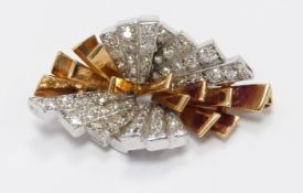 A bi-coloured pendant/ brooch set with diamonds in tiered sections, 7g, width 3.5cm x length 1.9cm