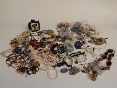 A collection of costume jewellery including earrings, necklaces, brooches,etc