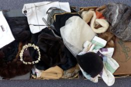 A collection of fur wraps and vintage handbags, makes include Gheradini