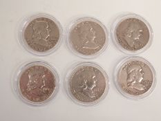 Six American Liberty half dollars in coin capsules for 1954, 1958, 1959, 1961 x2 and 1963