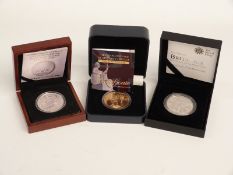 Three cased silver coins including 2011 and 2013 Britannias and a medal, all with certificates