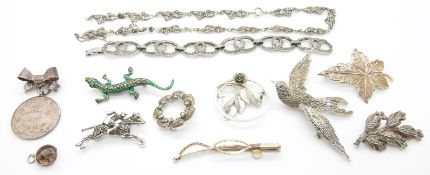 A collection of jewellery including silver and marcasite brooches, silver medallion etc