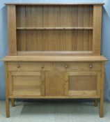 Heal & Son London light oak Arts & Crafts dresser or sideboard, having plate rack top with hanging