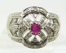 An 18ct white gold ring set with a ruby and diamonds (size N)