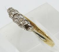 An 18ct gold ring set with diamonds in a platinum setting (size N)