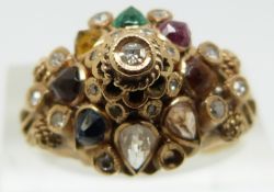A 18ct gold ring set with diamonds, a pink sapphire, emerald, tigers eye, garnet, citrine, topaz etc
