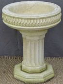 Garden planter with octagonal base, reeded column and leaf decoration to top, height 48cm