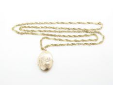 A 9ct gold chain/ necklace and 9ct gold locket with bird and foliate decoration, 10.6g, 41cm drop