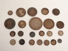 A small collection of largely UK silver coins to include George III shilling, Victorian half