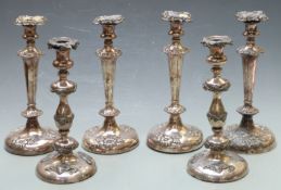Set of four silver plated candlesticks, height 30cm together with a further pair of candlesticks