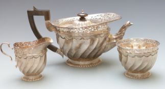 Victorian halmarked silver three piece tea set with wrythen and pierced decoration, teapot London