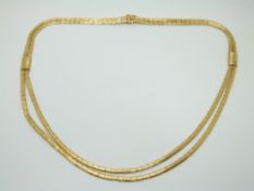 An 18ct gold necklace with textured detail, 34g