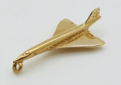 A 9ct gold Concorde charm, 1.8g