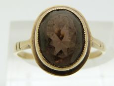 A 9ct gold ring set with paste (size N)