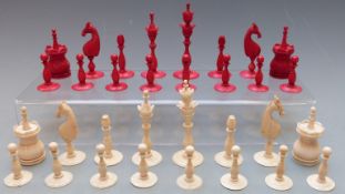 European 'Selenus' red and white turned and carved antique ivory chess set, c1800, height of king
