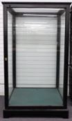 Ebonised wood museum or similar display cabinet with door to one side, width 120, height 208cm