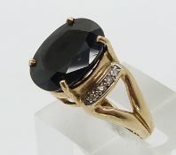 A 9ct gold ring set with a sapphire and diamonds (size N)