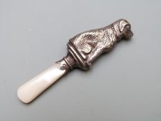 Hallmarked silver novelty dog baby's teething rattle with mother of pearl handle, Chester 1960