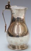 Edward VII Arts and Crafts style water pitcher or claret jug with acorn thumb piece to lid, London