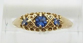 An 18ct gold ring set with sapphires and diamonds, Birmingham 1911 (size N)