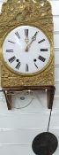 A 19thC French comptois wall clock with agricultural themed brass decoration and enamelled Roman
