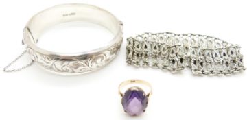 A 14ct gold ring set with a synthetic colour change sapphire, a hallmarked silver bangle and a
