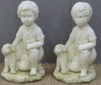 A pair of garden figures of a boy with dog, height 46cm