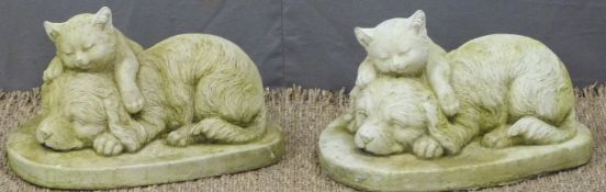 A pair of garden models of a dog and cat sleeping, length 33cm