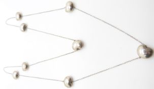 A bespoke silver necklace made up of stylised heart links