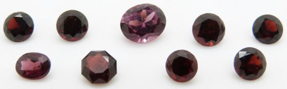 Two oval almandine garnets and 7 round cut garnets, 1.4g