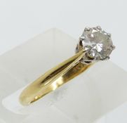 An 18ct gold ring set with a round cut diamond of approximately 0.65ct (size L)